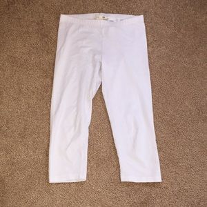 white “H&M” capris